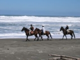 Horseriding on the beach at nearby Punakaiki