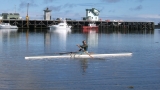 Andre rowing in the harbour at Westport